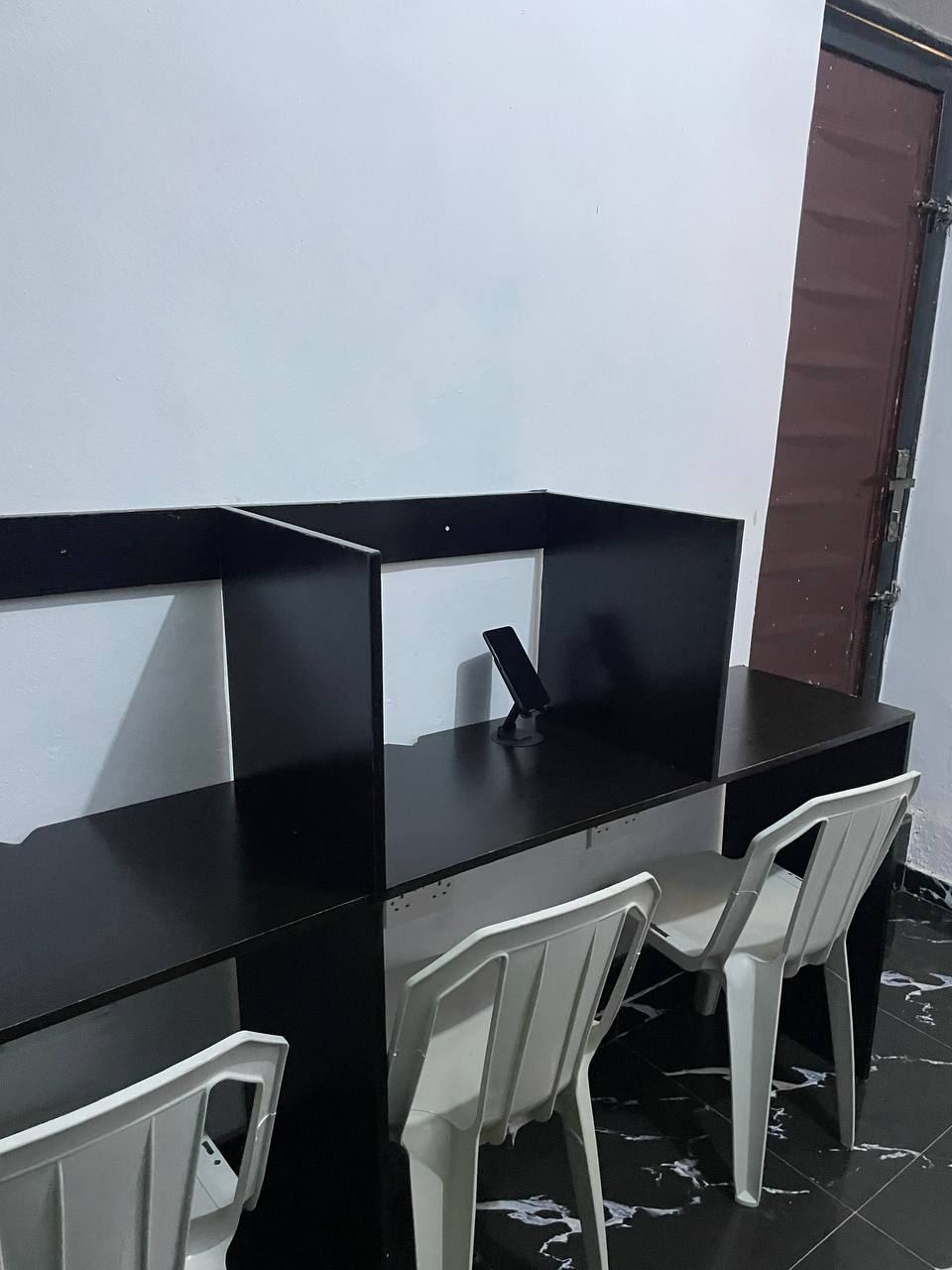 Desks with dividers at ZoneIn Hub