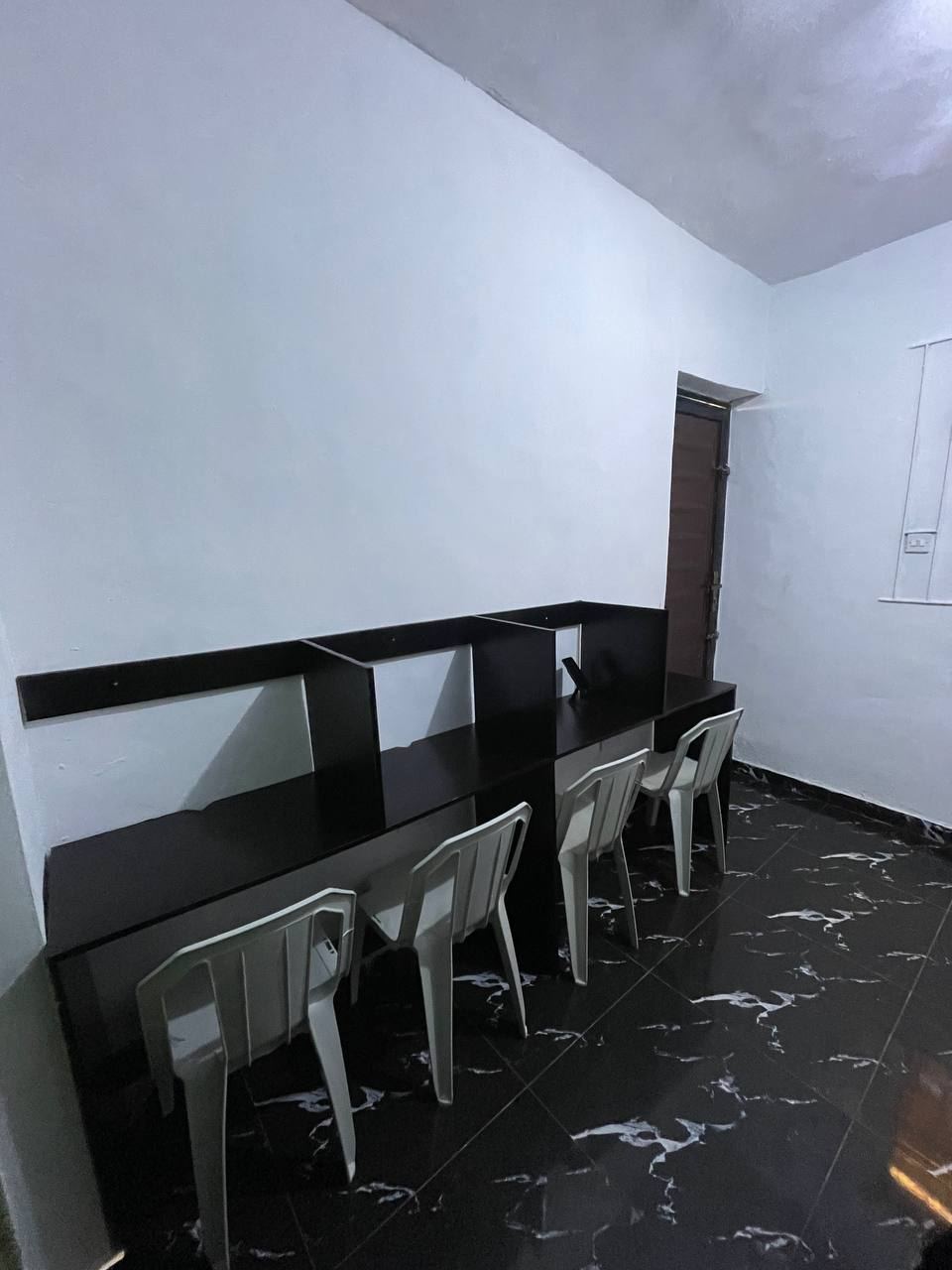 Desks along the wall at ZoneIn Hub