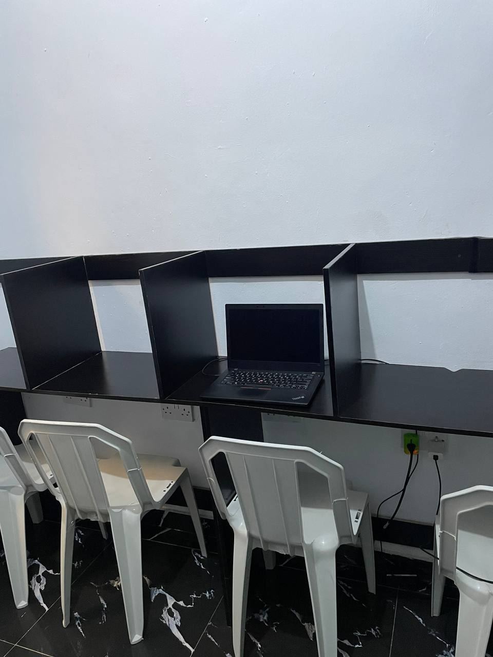A desk set up with a laptop at ZoneIn Hub